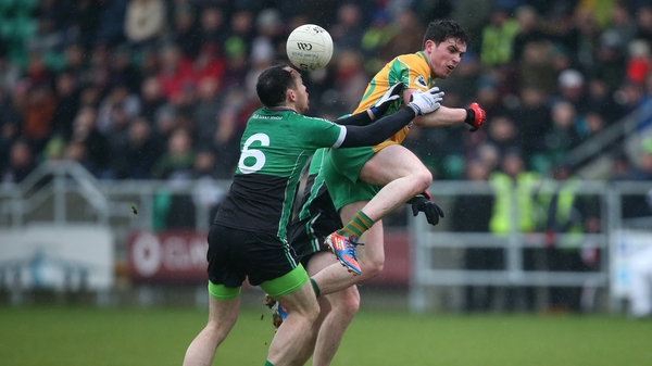 Fulham's Hurl Dockry tackles Corofin's Colin Brady