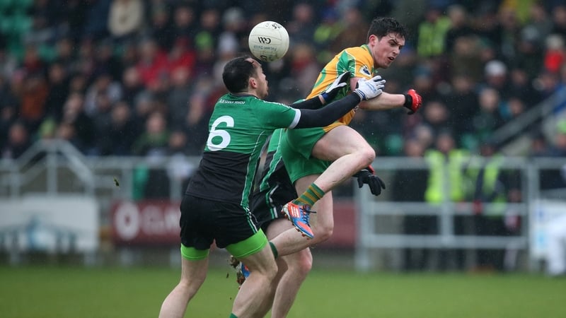 Fulham's Hurl Dockry tackles Corofin's Colin Brady