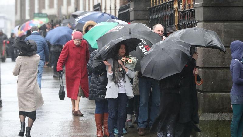 People queued outside the church to file past the open coffin and pay their respects
