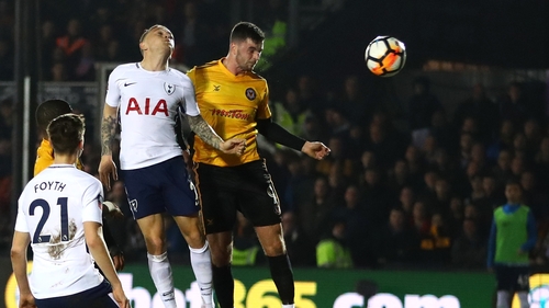 Padraig Amond heads home the opening goal at Rodney Parade as Newport held Spurs