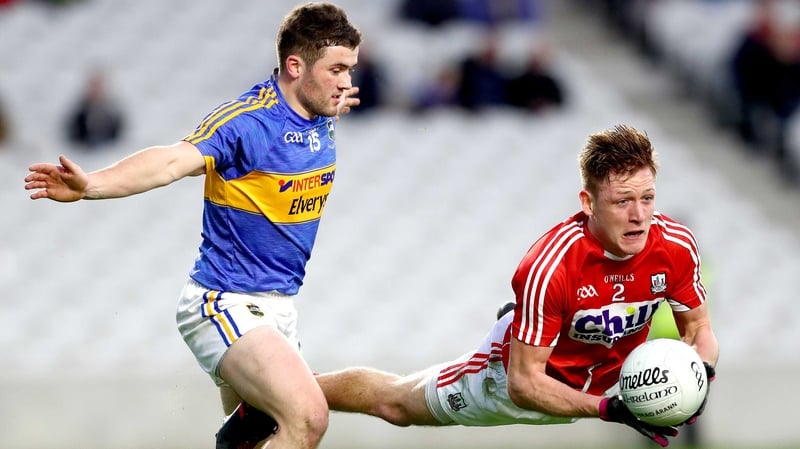 Tipperary's Liam McGrath (L) and Sam Ryan of Cork