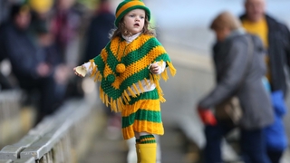 A young Donegal supporter cheers on the boys