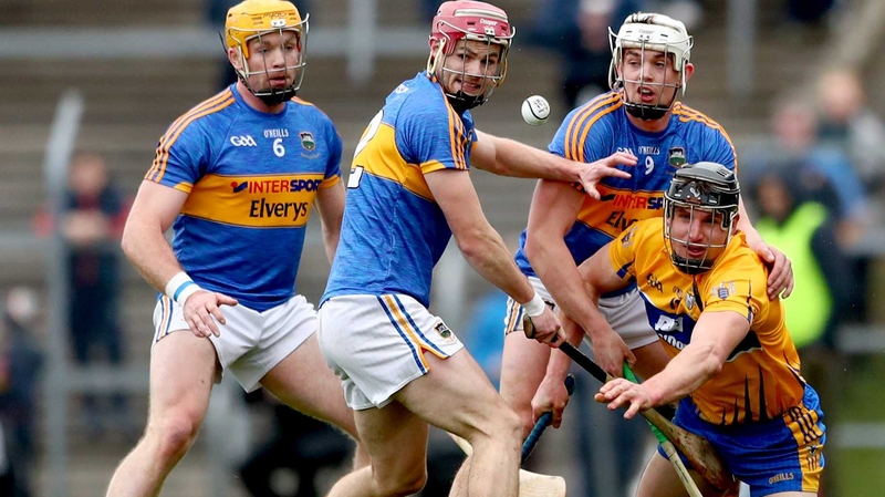 Tipperary's Padraic Maher, Alan Flynn and Ronan Maher with John Conlon of Clare