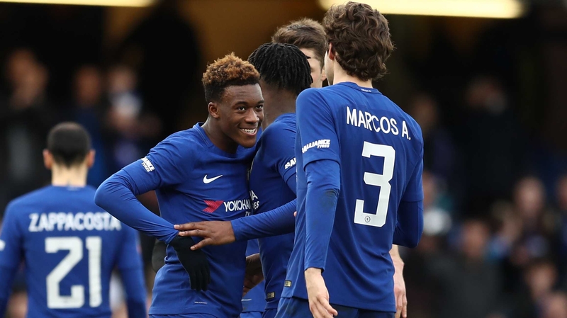 Michy Batshuayi is swamped by his Chelsea team-mates at Stamford Bridge