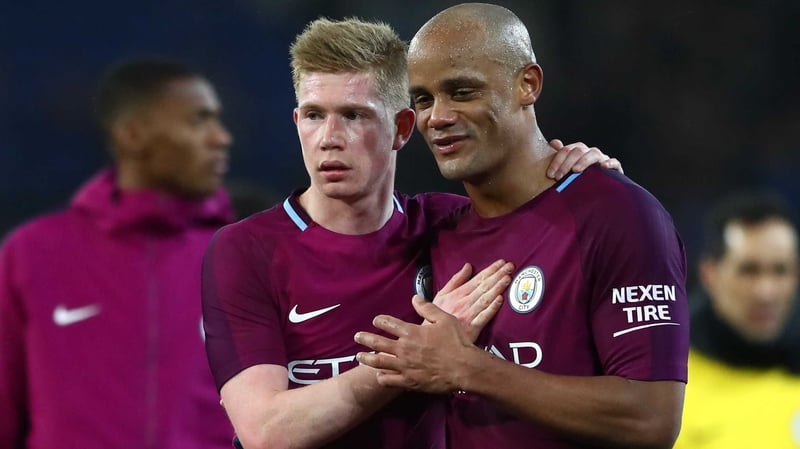 Kevin De Bruyne (L) and Vincent Kompany celebrate City's win