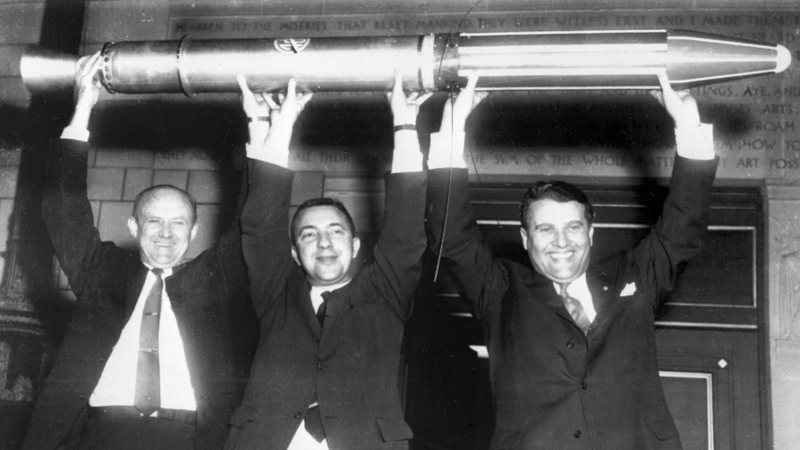 William Picketing, James Van Allen, and Wernher von Braun (from L to R) on 31 January 1958 with a model of 'Explorer 1'