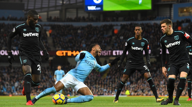 Sterling is tackled playing against West Ham