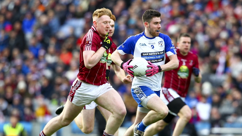 Knocknagree's Padraig Collins runs past Multyfarnham's Daniel Loughrey