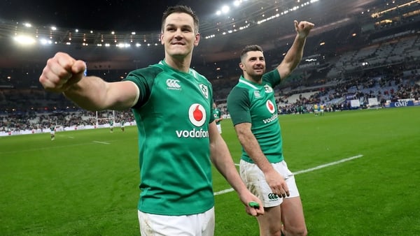 Johnny Sexton and Rob Kearney acknowledge the Irish fans after beating France in Paris