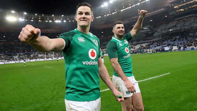 Johnny Sexton and Rob Kearney acknowledge the Irish fans after beating France in Paris
