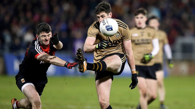 Mayo's Brendan Harrison with Kerry's Paul Geaney