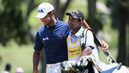 Shubhankar Sharma celebrates with his caddy