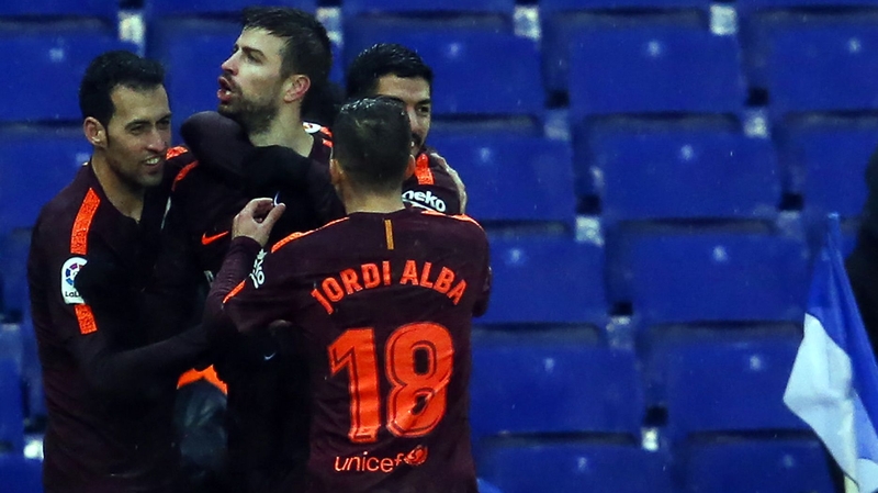 Gerard Pique is mobbed after his goal