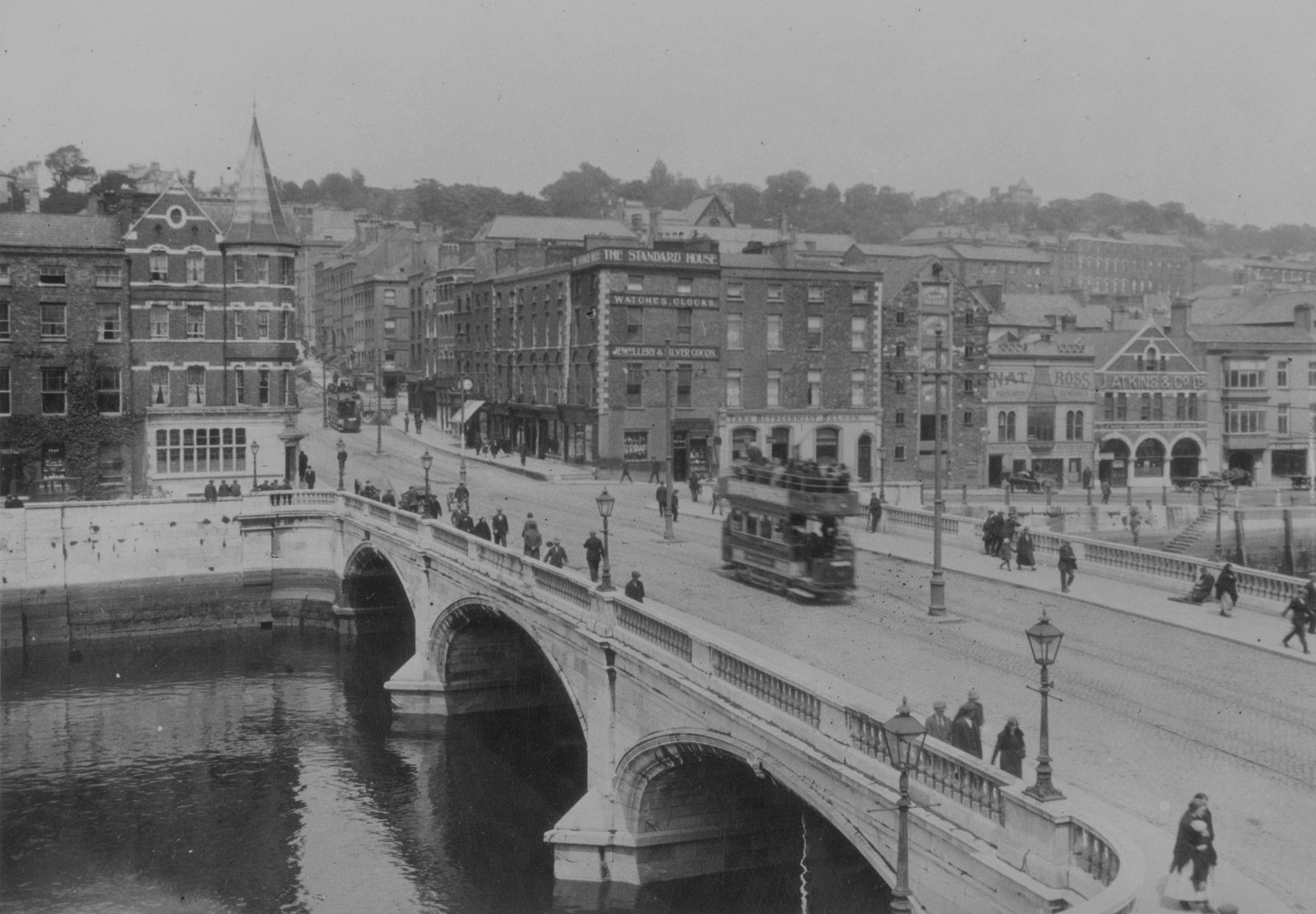 A tram crosses the bridge in Cork City, Ireland, circa 1930.