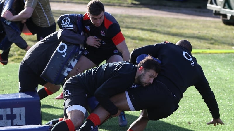 Danny Care tackles Jonathan Joseph during the England training