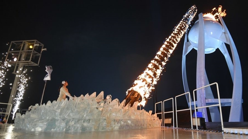 South Korean figure skater Kim Yu-na lights the cauldron with the Olympic Flame