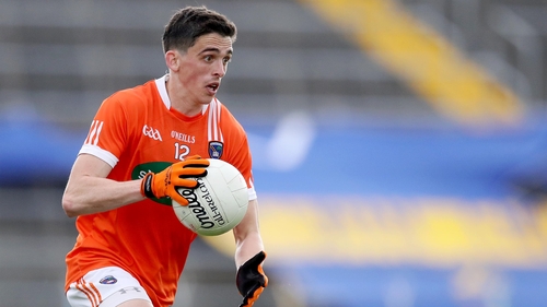 Rory Grugan scored three points as Armagh returned to Division 1 with victory in Ennis
