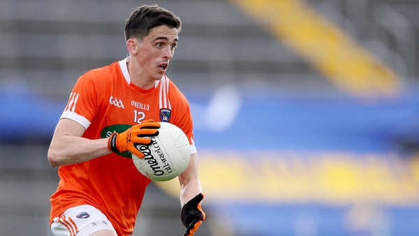 Rory Grugan scored three points as Armagh returned to Division 1 with victory in Ennis