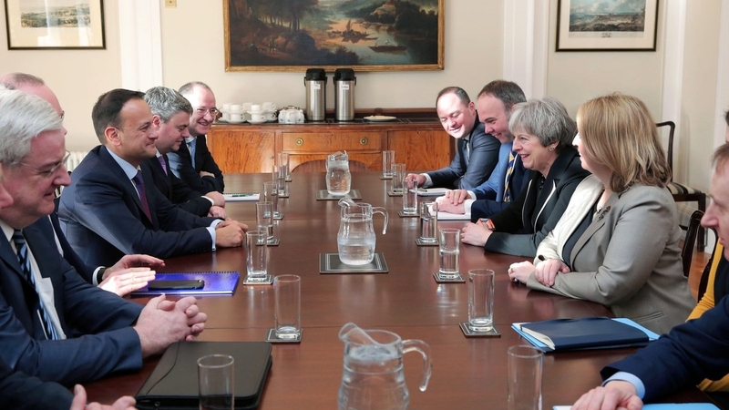 A photograph of the Irish and British government teams meeting in Stormont