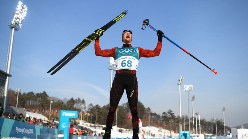 Dario Cologna of Switzerland celebrates after finishing