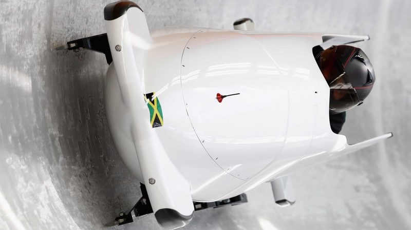 The Jamaican bobsled team slides down the track