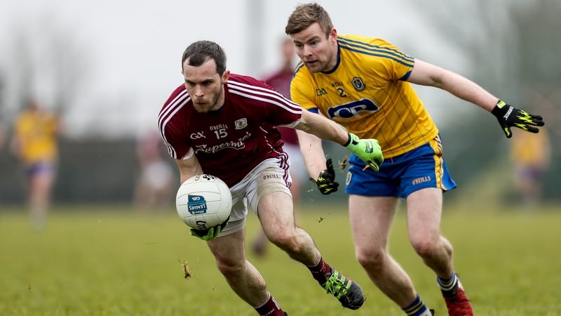 Frankie Burke and Peter Domican battle for possession