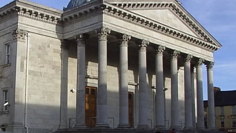 The court heard two loads of material had been put against the wall and a third was being unloaded when the wall collapsed