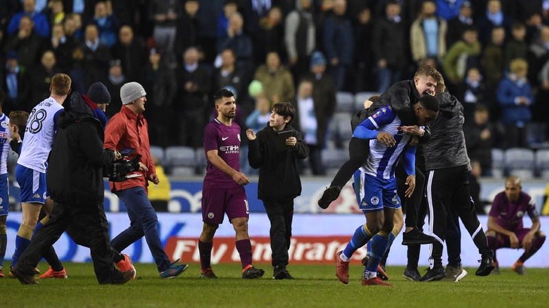 Sergio Aguero walks from the pitch after Mancehster City lost 1-0 to Wigan in the FA Cup tonight