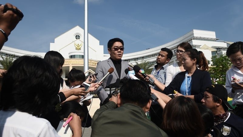 Lawyer Kong Suriyamontol speaks to reporters after the court hearing