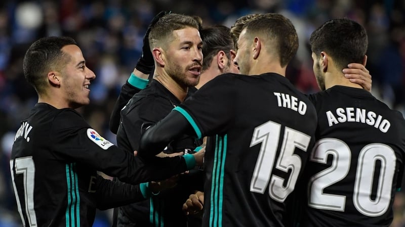 Real Madrid players mob Sergio Ramos after his goal