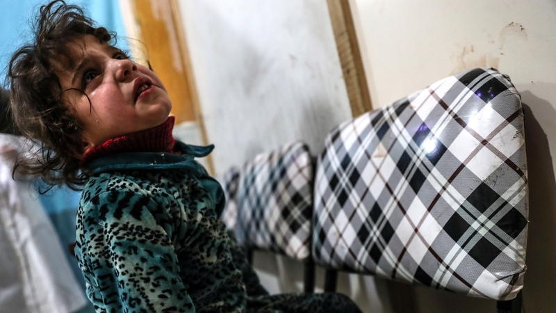 An injured child reacts inside a hospital to the bombing in Eastern Ghouta