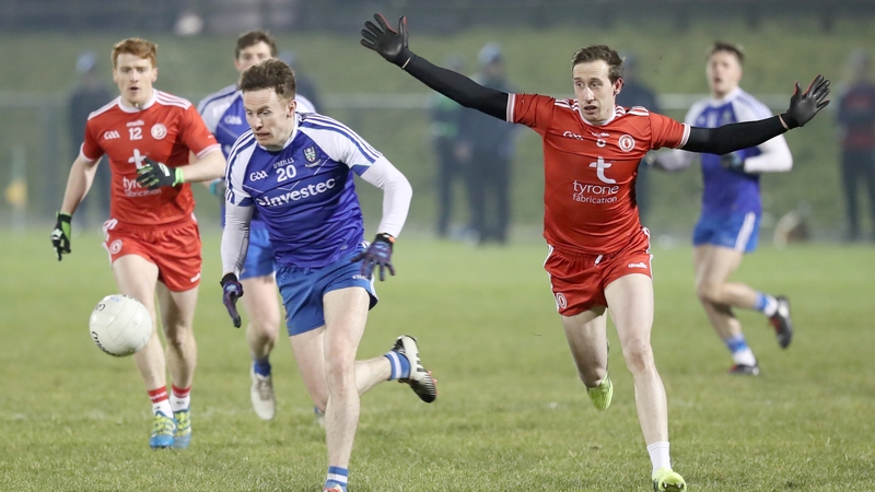 Fintan Kelly is pursued by Colm Cavanagh in Saturday night's tense battle