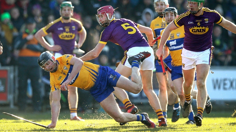 Wexford's Paudie Foley and Michael O'Malley of Clare in action