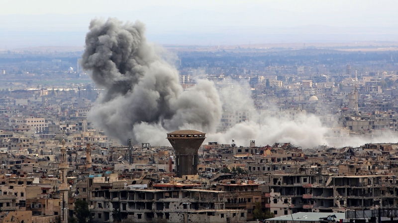 Smoke rises from the rebel-held enclave of Eastern Ghouta