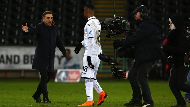 Carlos Carvalhal (L) celebrates with Jordan Ayew