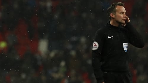 Fans in Wembley spent a lot of time watching the referee Paul Tierney touch his ear