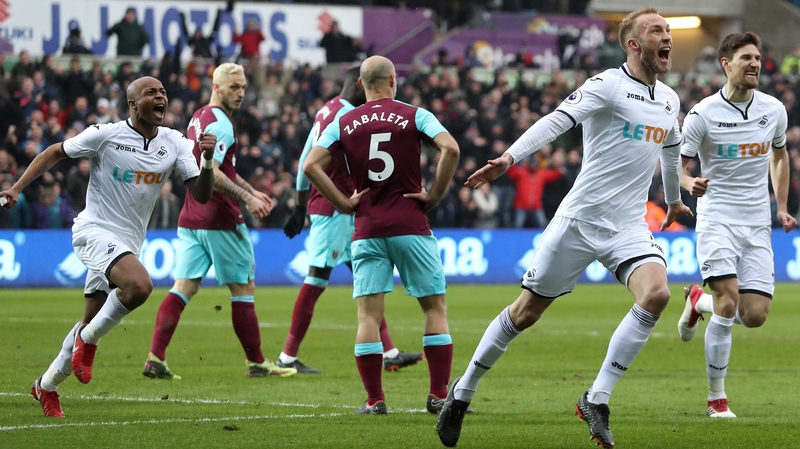 Mike van der Hoorn of Swansea City celebrates scoring his side's second goal