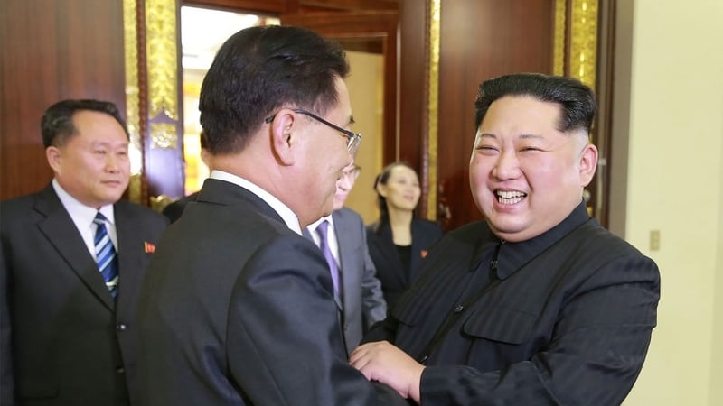 North Korean leader Kim Jong-un shaking hands with South Korean chief delegate Chung Eui-yong