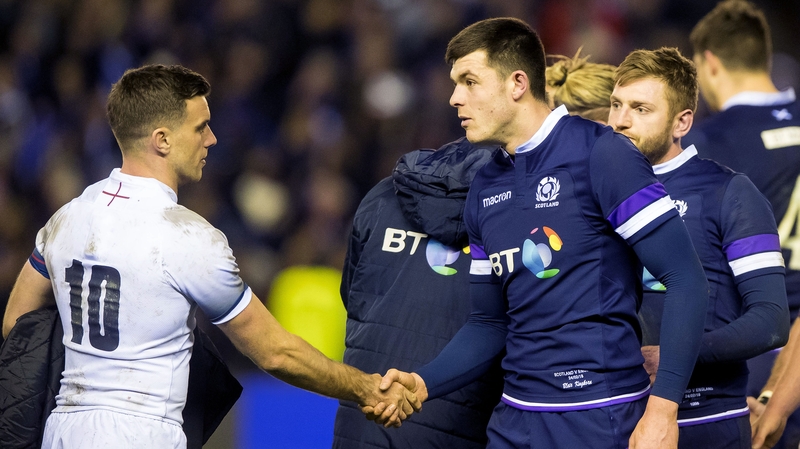 Kinghorn shakes hands with England's George Ford after Scotland's win