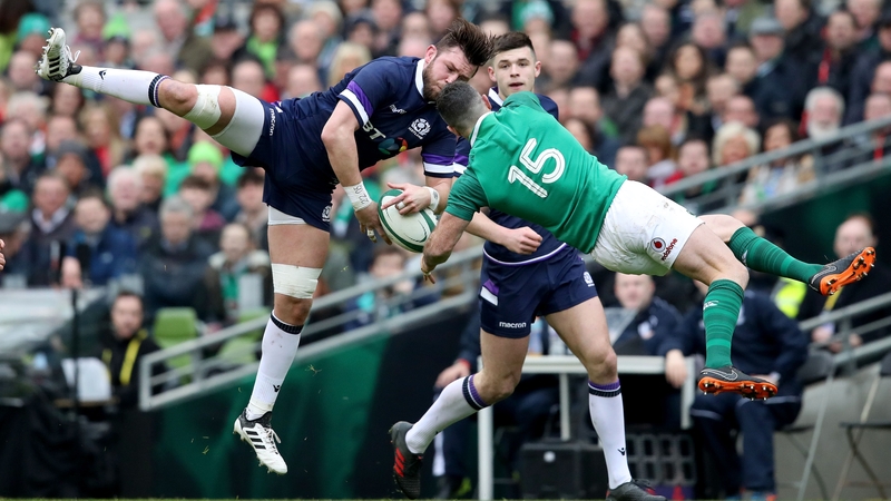 Scotland's Ryan Wilson and Ireland's Rob Kearney competing for the ball