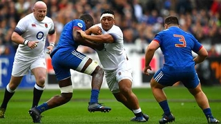 Mako Vunipola of England is tackled by Yacouba Camara of France