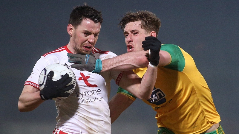 Hugh McFadden tackles Mattie Donnelly in the league clash in Healy Park