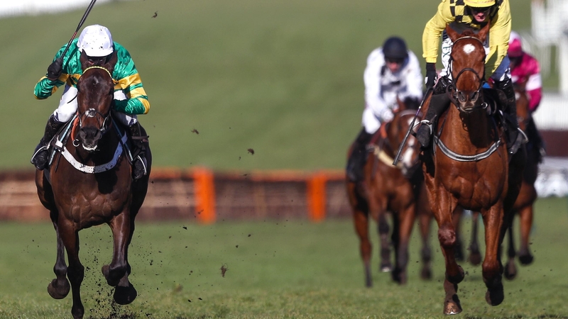 Buveur D'Air (left) battles home ahead of Melon to win the Champion Hurdle