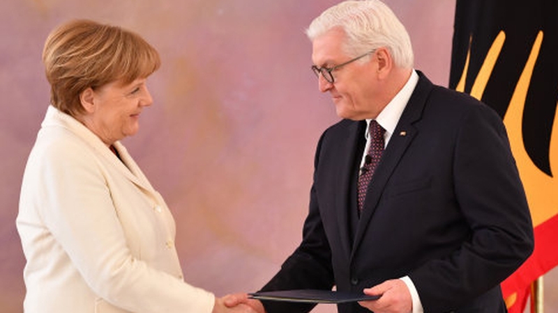 German Chancellor Angela Merkel receives her seal of office