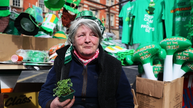 Kathleen Farrell sells St Patrick's Day merchandise on her stall on Thomas Street in Dublin