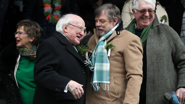 President Michael D Higgins and the St Patrick's Festival first international guest of honour, Star Wars actor Mark Hamill enjoy the Dublin parade.