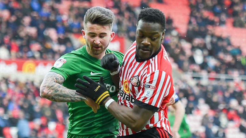 Sean Maguire (L) battles with Lamine Kone