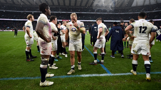 England players look dejected after the full-time whistle