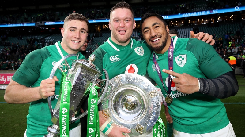 Larmour holds the silverware with Andrew Porter and Bundee Ake
