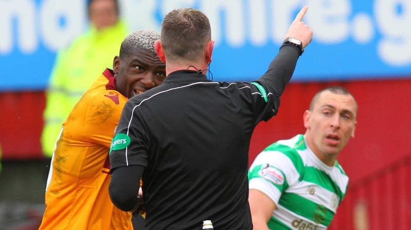 Referee Craig Thomson red-cards Cedric Kipre for pushing Scott Brown